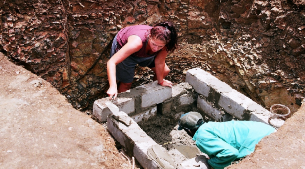 Volunteers helping to build a toilet